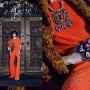 On Lika: Orange jumpsuit by Lako Bukia. Necklace by Atelier Marta. Rings by Eka Samkharadze, chunky cardigan by Bulli.