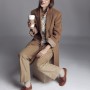 Fawn corduroy trousers, tasseled leather brogues, wool camel coat