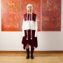 Wool burgundy fringed skirt, white cotton blouse and wool burgundy bib by Ruslan Panama; Boots by Rick Owens; Wool knit hat by Mandarin Narbayeva.